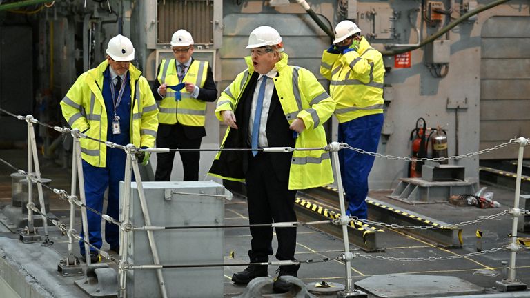 British Prime Minister, Boris Johnson is shown a vessel undergoing refit for the Ukrainian Navy during a visit of Rosyth Shipyard, in Rosyth, Scotland, Britain February 14, 2022. Jeff J Mitchell/Pool via REUTERS
