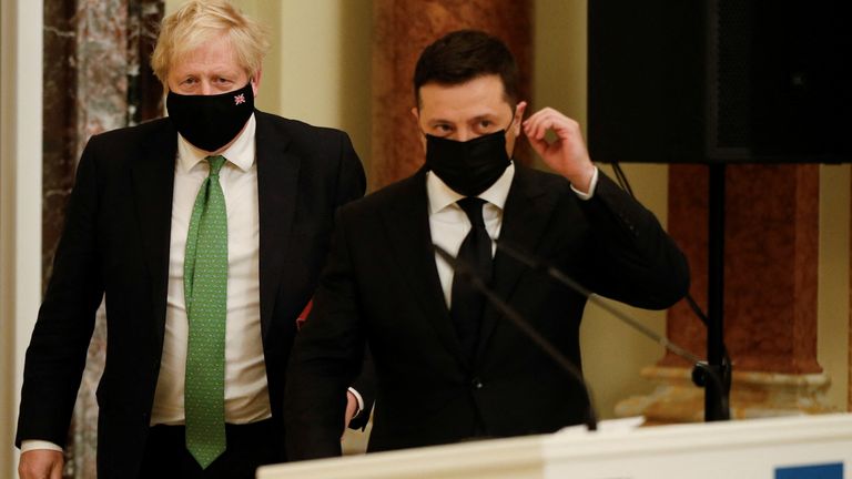 British Prime Minister Boris Johnson and Ukrainian President Volodymyr Zelenskyywear masks at a joint news conference in Kyiv, Ukraine February 1, 2022. REUTERS/Peter Nicholls/Pool
