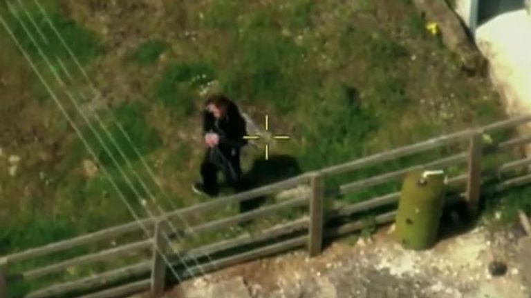 The murderer hopped a fence shortly before he was caught by police