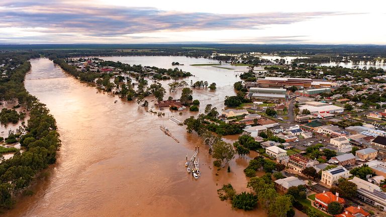 In this photo provided by the Fraser Coast Regional Council, water floods streets and houses in Maryborough, Australia, Monday, Feb. 28, 2022. Heavy rain is bringing record flooding to some east coast areas while the flooding in Brisbane, a population of 2.6 million, and its surrounds is the worst since 2011 when the city was inundated by what was described as a once-in-a-century event. (Queensland Fire and Emergency Services via AP)