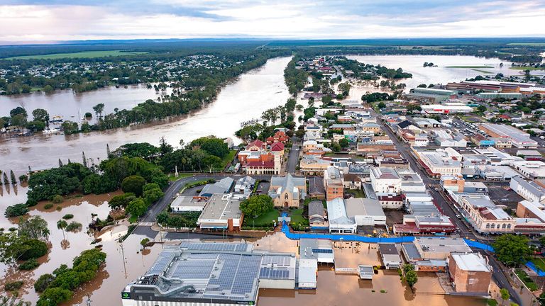 In this photo provided by the Fraser Coast Regional Council, water floods streets and houses in Maryborough, Australia, Monday, Feb. 28, 2022. Heavy rain is bringing record flooding to some east coast areas while the flooding in Brisbane, a population of 2.6 million, and its surrounds is the worst since 2011 when the city was inundated by what was described as a once-in-a-century event. (Queensland Fire and Emergency Services via AP)