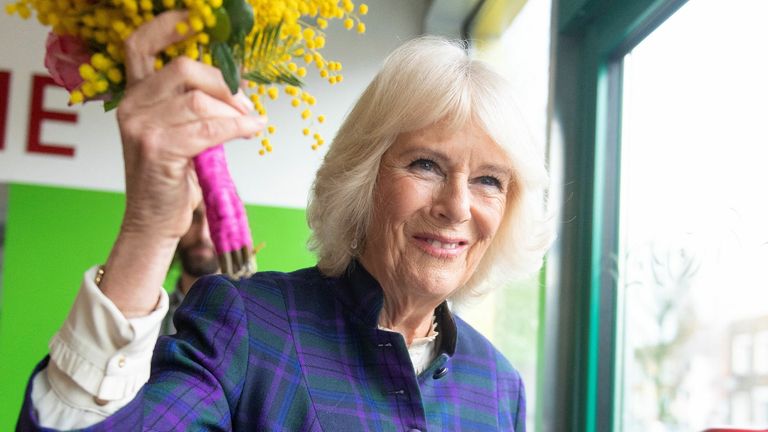 Britain&#39;s Camilla, Duchess of Cornwall holds flowers that she received during a visit to Nourish Hub, at Shepherd&#39;s Bush, London, Britain Feburary 10, 2022. Geoff Pugh/Pool via REUTERS
