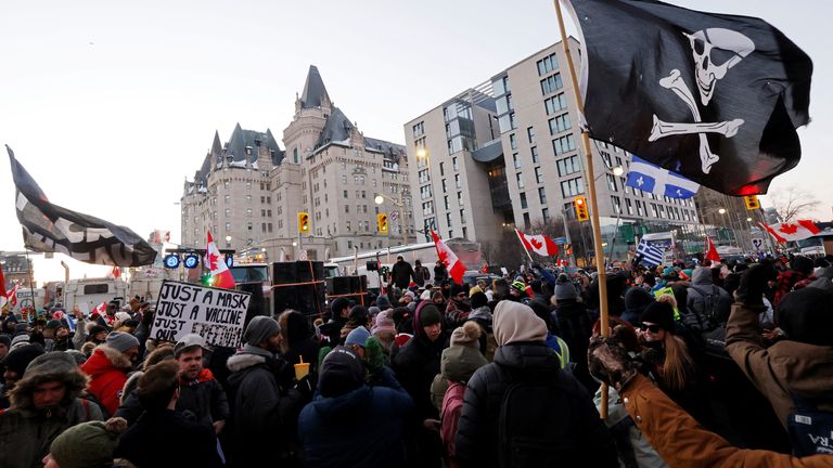 Demonstrators have a dance party in the street outside the Rideau Centre as truckers and supporters continue to protest coronavirus disease (COVID-19) vaccine mandates, in Ottawa, Ontario, Canada, February 5, 2022. REUTERS/Blair Gable
