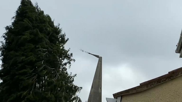 Footage showed the moment the spire wobbled and then toppled from the church
