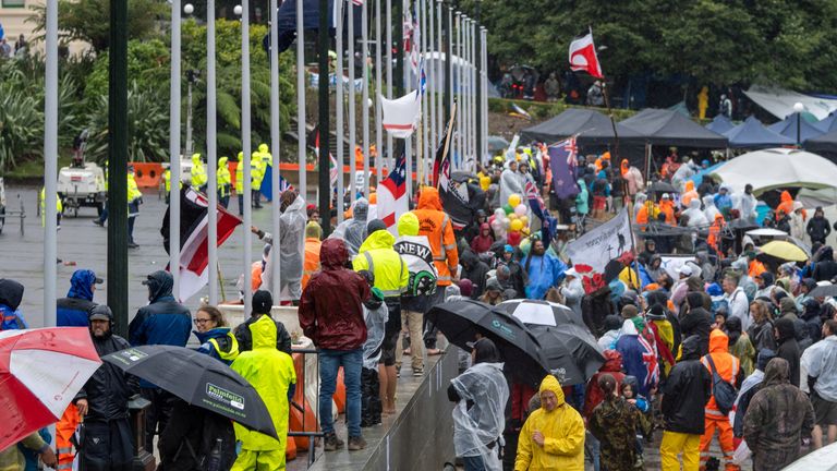 Protestors rally against coronavirus disease (COVID-19) vaccination mandates despite the rain near the parliament building in Wellington, New Zealand February 13, 2022. Pic: Charlie Coppinger