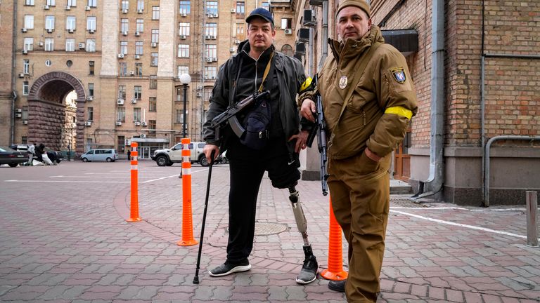 Armed civil defence men pose for a photo while patrolling an empty street due to curfew in Kyiv, Ukraine, Sunday, Feb. 27, 2022. A Ukrainian official says street fighting has broken out in Ukraine...s second-largest city. Russian troops also put increasing pressure on strategic ports in the country...s south following a wave of attacks on airfields and fuel facilities elsewhere that appeared to mark a new phase of Russia...s invasion. (AP Photo/Efrem Lukatsky).
PIC:AP