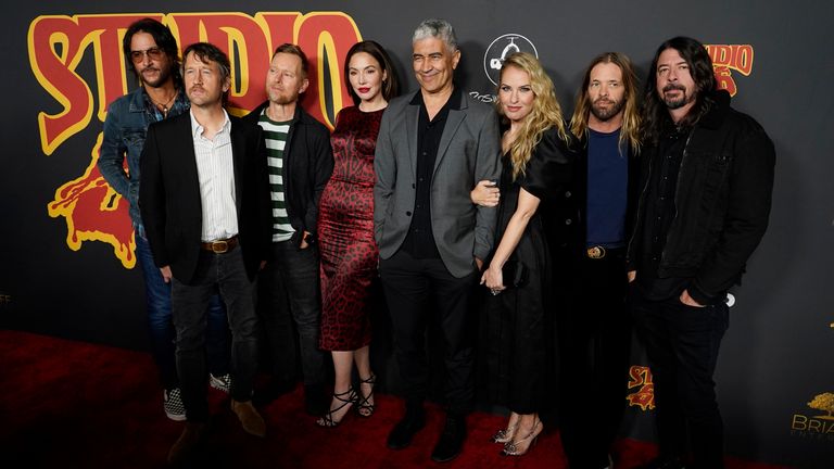 Foo Fighters bandmates and Studio 666 cast members, from left, Rami Jaffee, Chris Shiflett, Nate Mendel, Whitney Cummings, Pat Smear, Leslie Grossman, Taylor Hawkins and Dave Grohl at the film&#39;s premiere at the TCL Chinese Theatre in Los Angeles. Pic: AP/Chris Pizzello