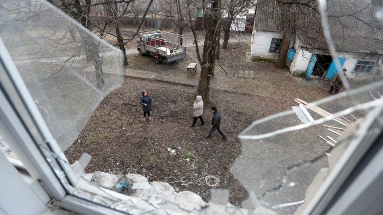 A view shows a broken window in a school building, which locals said was damaged by recent shelling, in the separatist-controlled city of Donetsk, Ukraine February 21, 2022. REUTERS/Alexander Ermochenko
