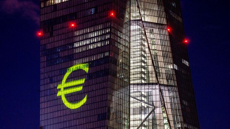 A light installation is projected onto the building of the European Central Bank during a rehearsal in Frankfurt, Germany, Thursday, Dec. 30, 2021. The light show will mark the 20th anniversary of the European currency Euro on New Year...s Eve. (Photo/Michael Probst)