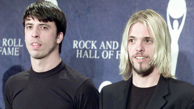 Dave Grohl (L) and Taylor Hawkins (R) of the Foo Fighters pictured at the Rock and Roll Hall of Fame Ceremony in New York in 2001, where they introduced Queen for induction
