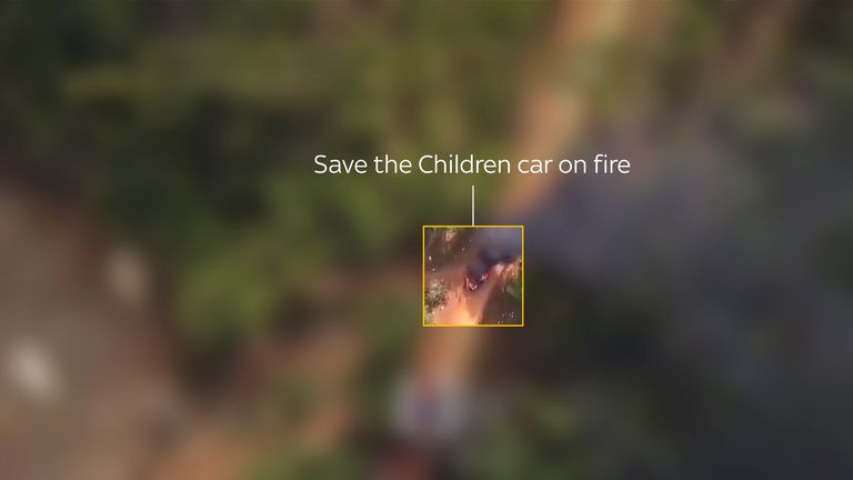 A car we identified as the one driven by two Save the Children staff is seen on fire.  Pic: KNDF