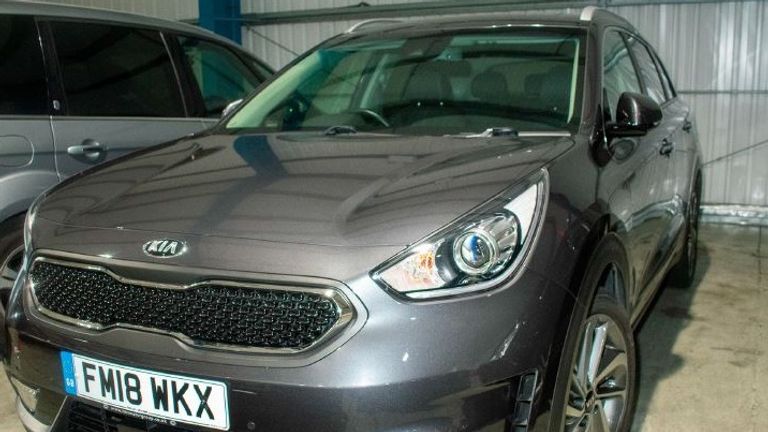 The grey Kia Niro may have also been using a vehicle warning sign. Pic: Met Police 