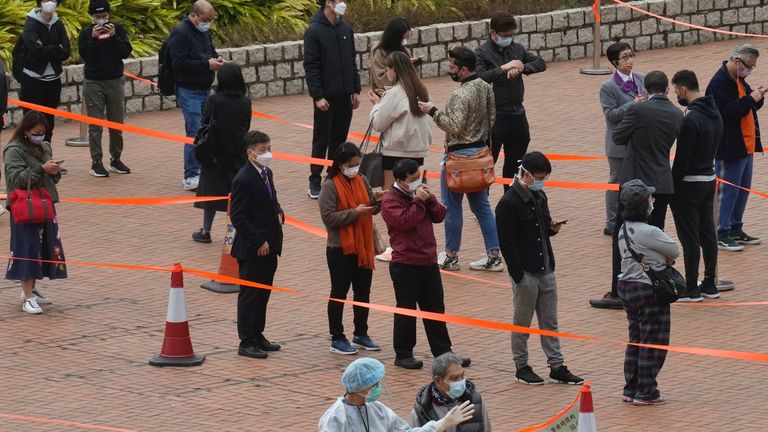 Residents queue up to get tested for the coronavirus at a temporary testing center. Pic: AP