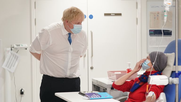Prime Minister Boris Johnson speaks to patient Kathryn Wills during a visit to the Northern Centre for Cancer Care, North Cumbria, in Carlisle, as part of his tour of the UK. Picture date: Monday February 14, 2022.
