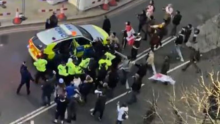 BEST QUALITY AVAILABLE Video grab image courtesy of Conor Noon of clashes between police and protesters in Westminster as officers use a police vehicle to escort Labour leader Sir Keir Starmer to safety. Picture date: Monday February 7, 2022.