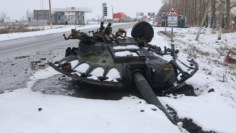 The turret of a destroyed tank is seen on the roadside in Kharkiv, Ukraine