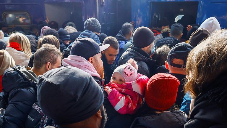 People wait to board an evacuation train from Kyiv to Lviv at Kyiv central train station, Ukraine, February 25, 2022. REUTERS/Umit Bektas