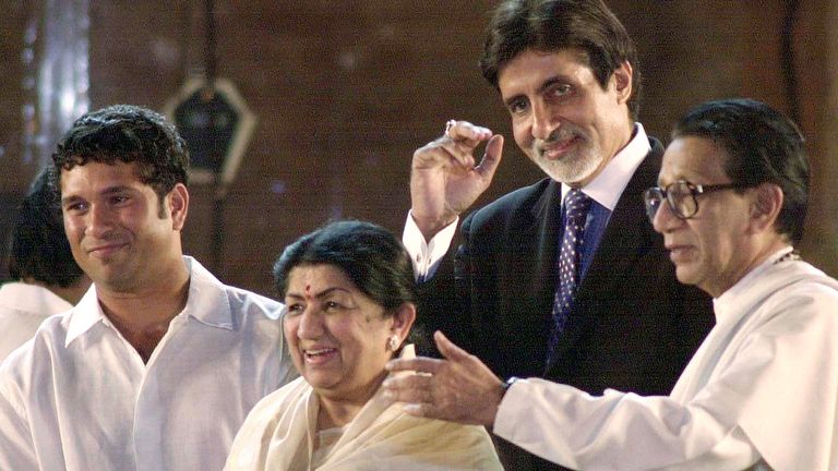Indian celebrities (L to R) cricketer Sachin Tendulkar, singer Lata Mangeshkar, Bollywood actor Amitabh Bachchan and leader of the militant right-wing Shiv Sena Party Bal Thackeray appear during a concert in Bombay, late March 5, 2001. The concert was organised by Shiv Sena Party to collect funds in aid of quake relief. SK/DL
