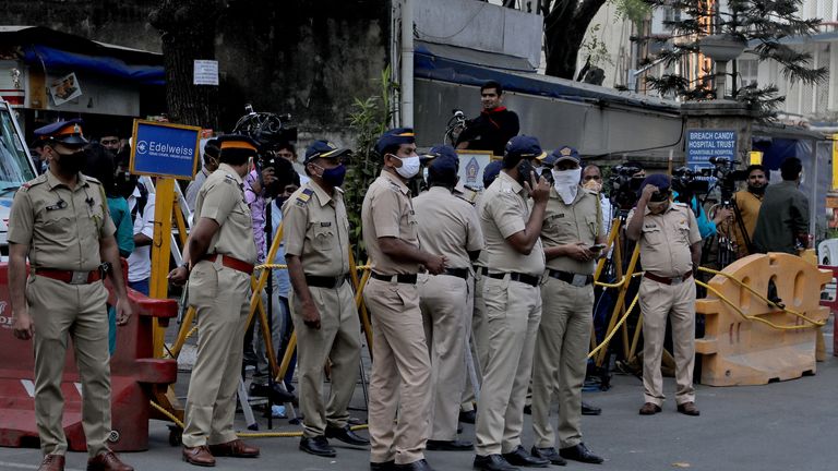 Police and members from the media stand outside the Breach Candy Hospital after the death of singer Lata Mangeshkar in Mumbai, India, February 6, 2022. REUTERS/Niharika Kulkarni
