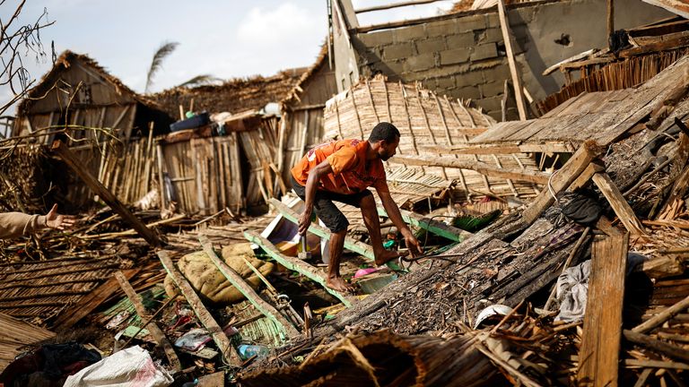 A man works on the destroyed house of Philibert Jean Claude Razananoro, in the aftermath of Cyclone Batsirai, in the town of Mananjary, Madagascar, February 8, 2022. REUTERS/Alkis Konstantinidis