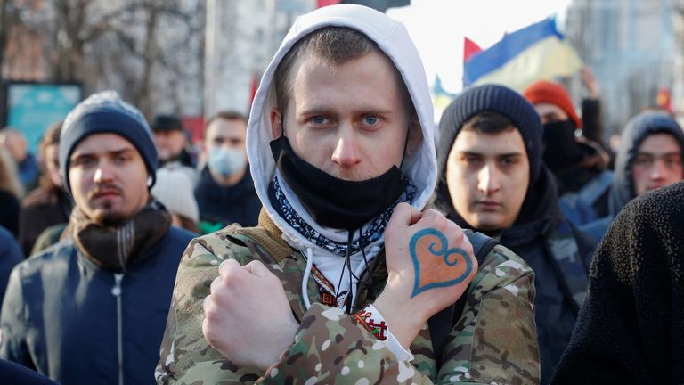 People take part in the Unity March, which is a procession to demonstrate Ukrainians&#39; patriotic spirit amid growing tensions with Russia, in Kyiv, Ukraine February 12, 2022. REUTERS/Valentyn Ogirenko
