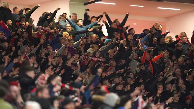 Middlesbrough fans celebrate after the English FA Cup fourth round soccer match between Manchester United and Middlesbrough at Old Trafford stadium in Manchester, England, Friday, Feb. 4, 2022. (AP Photo/Jon Super)
