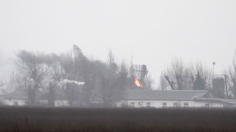 Fire is seen coming out of a military installation near the airport, after Russian President Vladimir Putin authorized a military operation in eastern Ukraine, in Mariupol, February 24, 2022. REUTERS/Carlos Barria  
