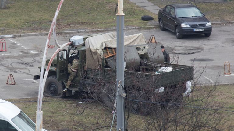 A view shows a damaged unidentified military truck at a residential area in Kyiv, Ukraine February 25, 2022. REUTERS/Olga Yakimovich
