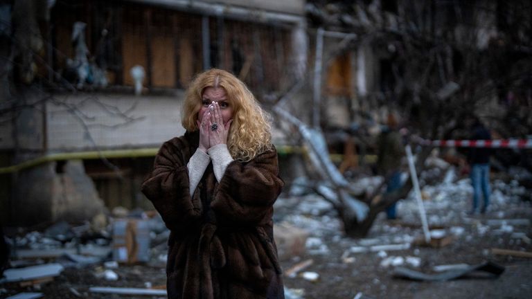 Natali Sevriukova reacts as she stands next to her house following a rocket attack in the city of Kyiv, Ukraine, Friday, Feb. 25, 2022. (AP Photo/Emilio Morenatti)
PIC:AP