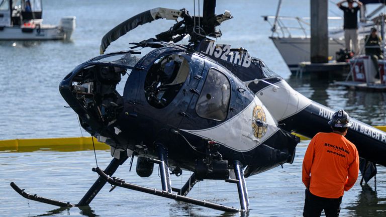 The helicopter being lifted from the water. Pic: AP 