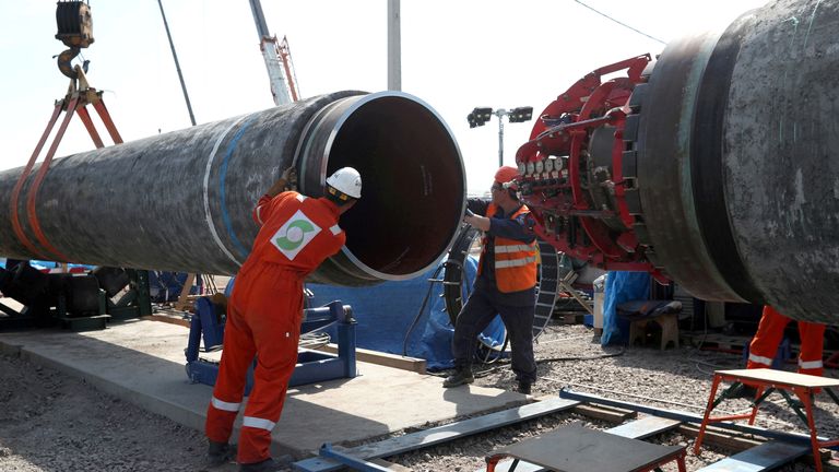 Workers are seen at the construction site of the Nord Stream 2 gas pipeline, near Kingisepp, Russia