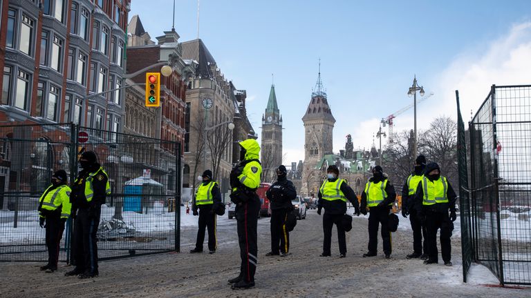 Police restrict access to the streets around Parliament Hill to end to a protest which started in opposition to mandatory COVID-19 vaccine mandates. Pic: AP