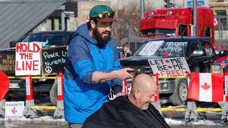 A barber cutting hair as truckers and their supporters continue to protest COVID-19 mandates