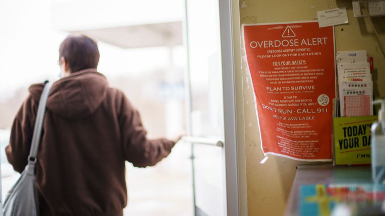 A sign calling attention to drug overdoses is posted to the door of a gas station on the White Earth reservation in Ogema, Minn., Tuesday, Nov. 16, 2021. Pic: AP