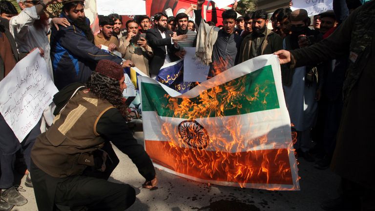 Students in Peshawar, Pakistan, burn a representation of Indian flag as they chant slogans during a protest. Pic: AP