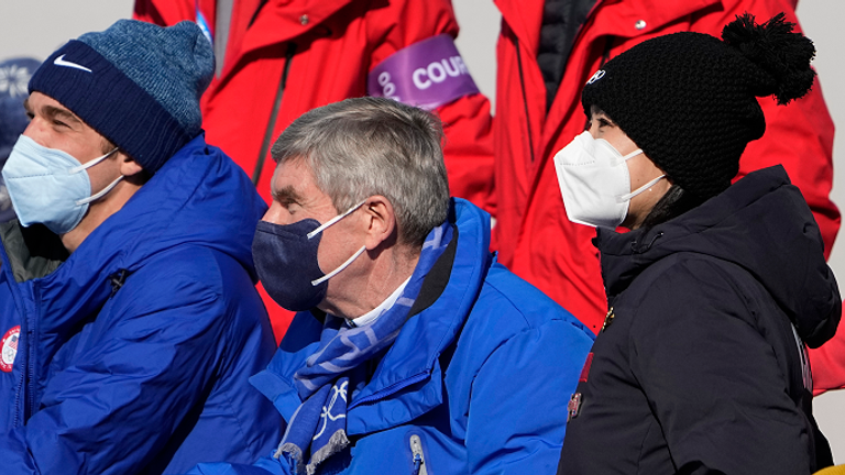 Peng Shuai saw the women's freestyle skiing big air finals with IOC president Thomas Bach, centre