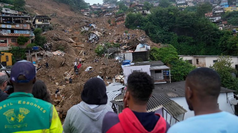 Rescue workers and residents look for victims  in an area affected by landslides in Petropolis, Brazil, Wednesday, Feb. 16, 2022. Extremely heavy rains set off mudslides and floods in a mountainous region of Rio de Janeiro state, killing multiple people, authorities reported. (AP Photo/Silvia Izquierdo)#
PIC:AP