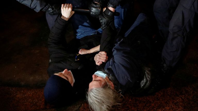 Police officers detain demonstrators during an anti-war protest in Saint Petersburg, Russia 