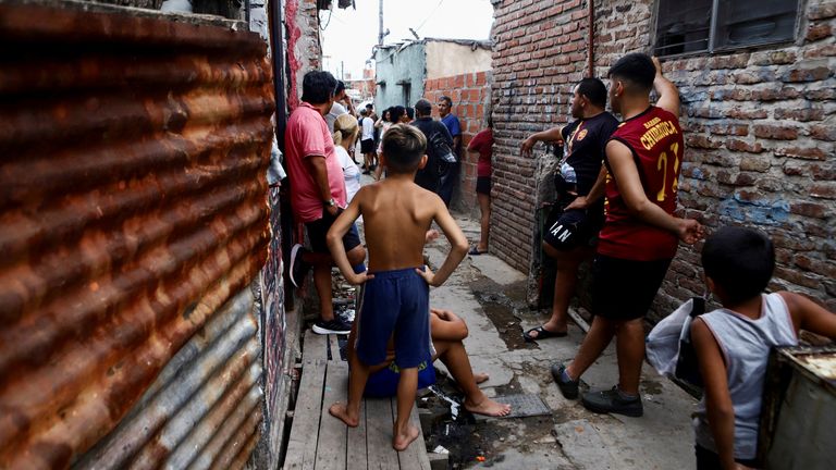 Residents are seen in the low-income neighbourhood "Puerta 8" where according to local media people bought cocaine suspected of containing a poisonous substance, on the outskirts of Buenos Aires, Argentina February 2, 2022