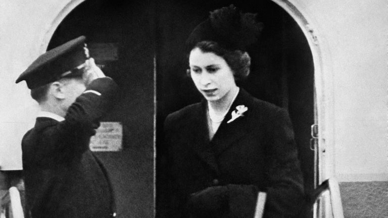 Dressed in black Queen Elizabeth II sets foot on British soil for the first time since her accession as she lands at London Airport after her day and night flight from Kenya following the death of her father, King George VI.