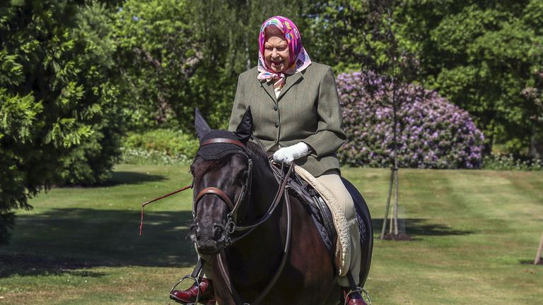 File photo dated 31/5/2020 of Queen Elizabeth II riding Balmoral Fern, a 14-year-old Fell Pony, in Windsor Home Park, close to Windsor Castle where she was in residence during the coronavirus pandemic. More than any other interest, horses and ponies have been the Queen&#39;s passion throughout her long life. Issue date: Sunday January 30, 2022.