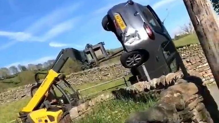  video played at Durham Crown Court showing farmer Robert Hooper, 57, of Brockersgill Farm, Newbiggin-in-Teesdale, County Durham, using a farm vehicle to remove a Vauxhall Corsa from his land last June. Mr Hooper is on trial at Durham Crown Court where he denies dangerous driving and criminal damage. Issue date: Tuesday February 1, 2022.