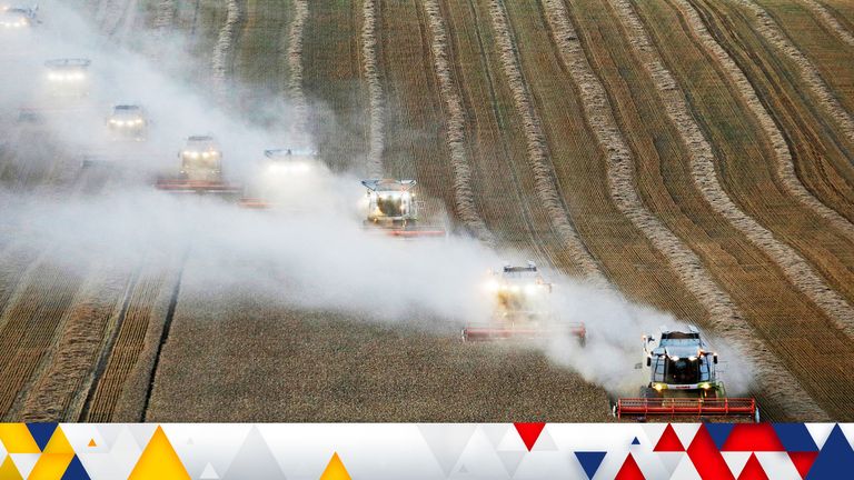 FILE PHOTO: Combines harvest wheat in a field near the village of Suvorovskaya in Stavropol Region, Russia July 17, 2021. REUTERS/Eduard Korniyenko/File Photo
