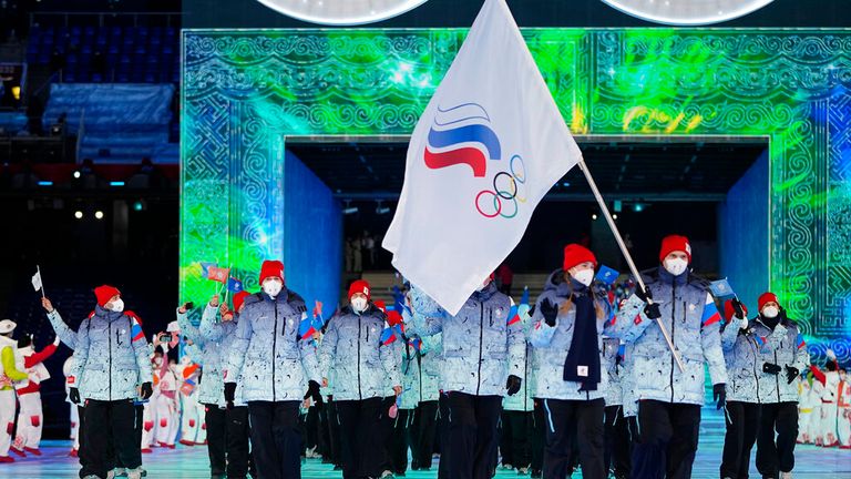 Russian athletes carry the ROC flag at the opening ceremony in Beijing on 4 February. Pic: AP