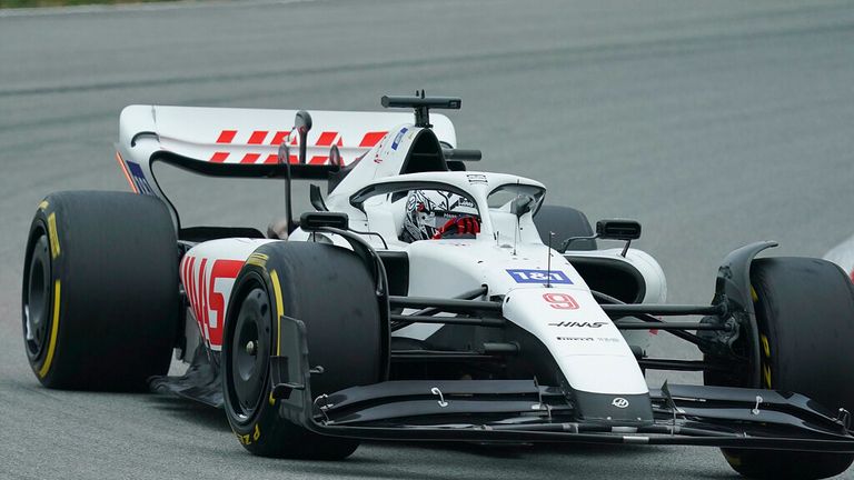 Russian driver Nikita Mazepin drives an all-white Haas F1 car in testing in Barcelona after the company dropped sponsor Uralkali