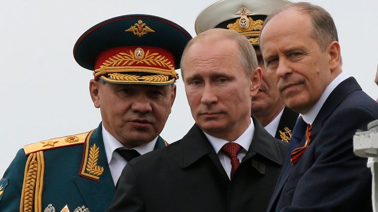 Russian President Vladimir Putin (C), Defence Minister Sergei Shoigu (L) and Russia&#39;s Federal Security Service (FSB) Director Alexander Bortnikov watch events to mark Victory Day in Sevastopol May 9, 2014.  Putin went to Crimea on Friday for the first time since Russia annexed the peninsula from Ukraine in March, a visit that is likely to anger the Ukrainian leadership and upset the West. REUTERS/Maxim Shemetov (UKRAINE - Tags: POLITICS ANNIVERSARY CONFLICT PROFILE MILITARY)