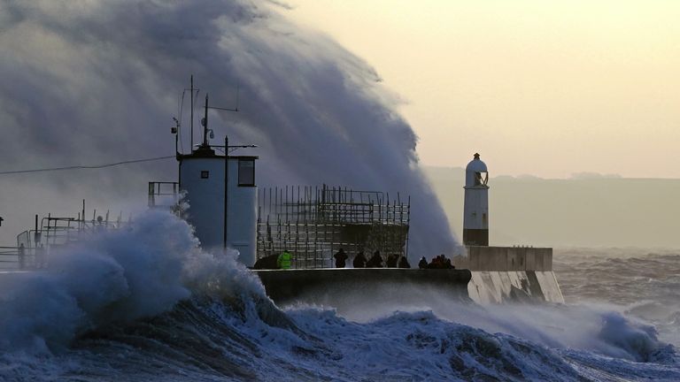 Waves crash against the sea wall and Porthcawl Lighthouse in Porthcawl, Bridgend, Wales, as Storm Eunice hits the south coast, with attractions closing, travel disruption and a major incident declared in some areas, meaning people are warned to stay indoors. A rare red weather warning - the highest alert, meaning a high impact is very likely - has been issued by the Met Office due to the combination of high tides, strong winds and storm surge. Picture date: Friday February 18, 2022.