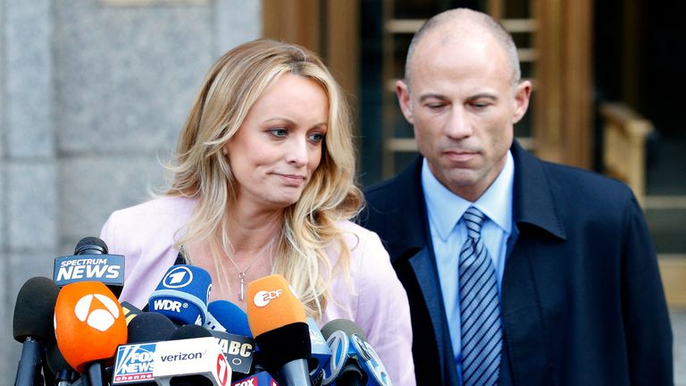  Adult film actress Stephanie Clifford, also known as Stormy Daniels, speaks to media along with lawyer Michael Avenatti (R) outside federal court in the Manhattan borough of New York City, New York, U.S., April 16, 2018. REUTERS/Brendan Mcdermid/File Photo