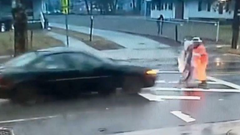 A police officer pushed a student out of the path of a car which failed to stop