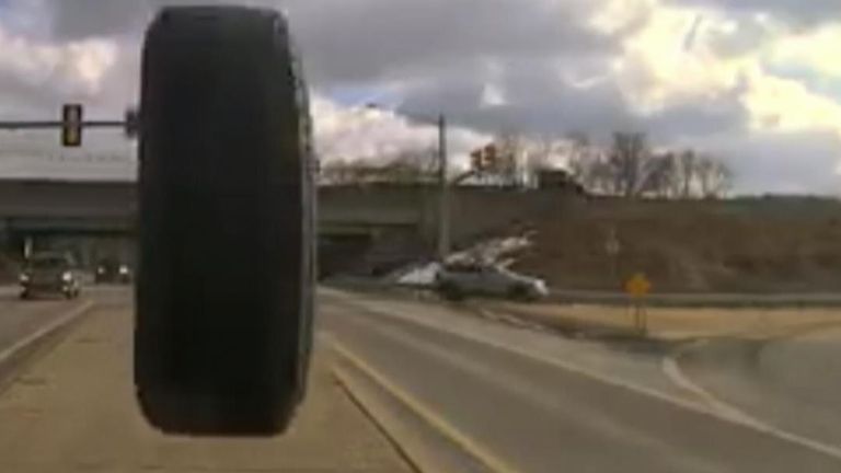 Bouncing tyre smashes police car windscreen